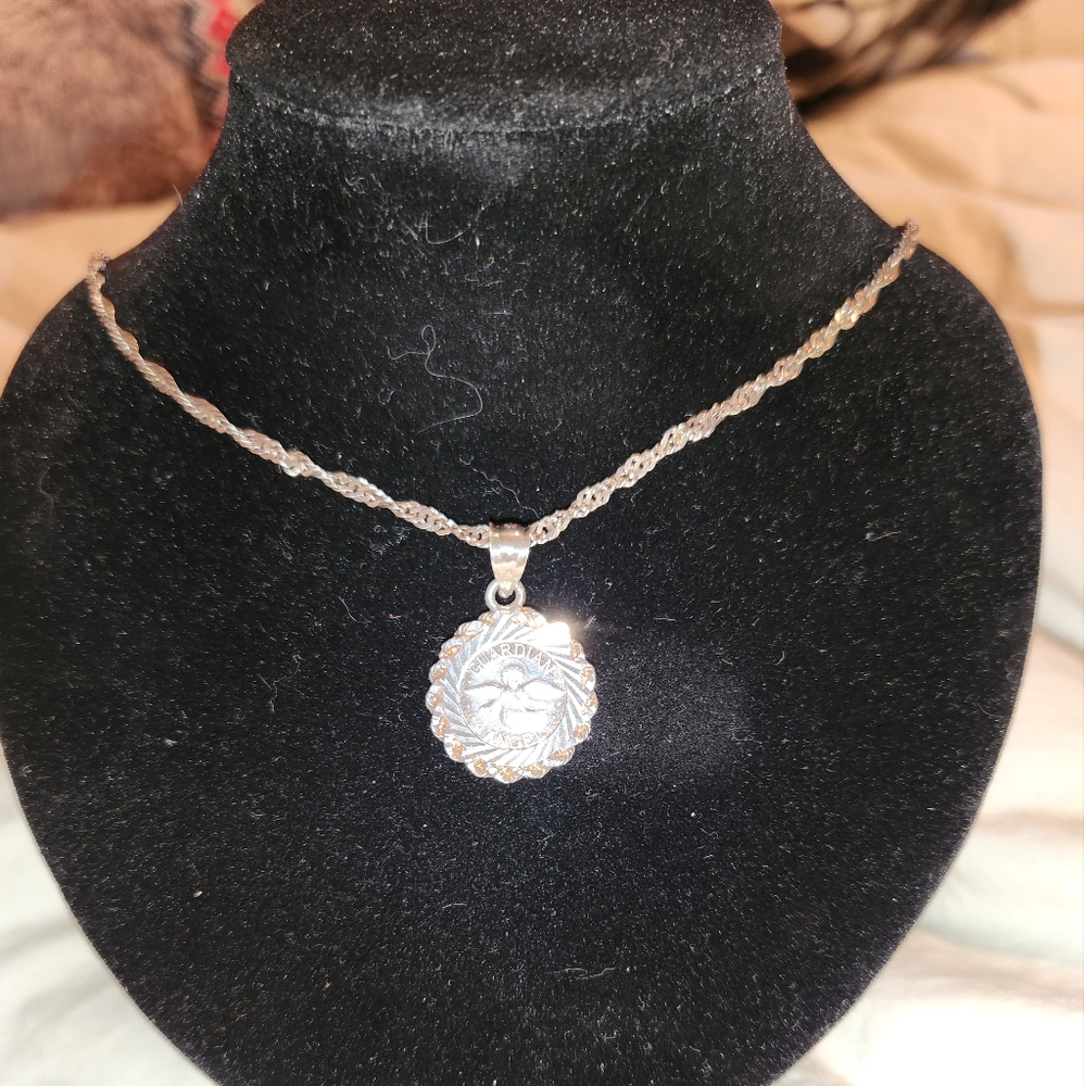Women's .999 Pure Silver Guardian Angel" Coin Pendant on a .925 19" Chain.
